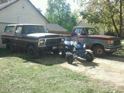 1979 Ford Bronco - This 1979 Ford Bronco is parked alongside a pickup truck and an ATV.