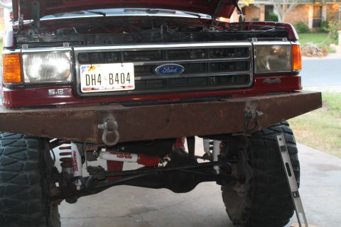 1990 Ford Bronco - Front view of a 1990 Ford Bronco, a custom bumper and the iconic Ford grille.