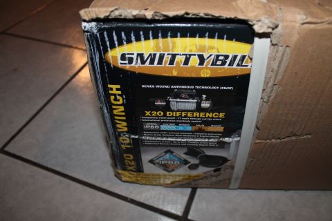 1990 Ford Bronco - The box for a Smittybilt X20 winch is shown, detailing its "SWAT" technology and "X20 Difference" features.