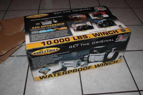 1990 Ford Bronco - The box for a Smittybilt X20 winch is shown, detailing its features and capabilities.