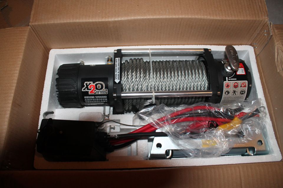 X20 10,000 lb amphibious winch with red and yellow cables, new in box