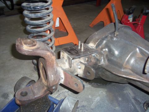 1968 Ford Bronco - Close-up of vehicle differential and suspension components, likely undergoing modification or repair, with a Supermotors watermark visible.