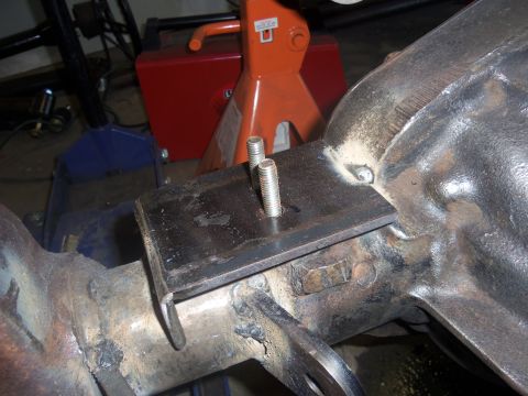 1968 Ford Bronco - Custom differential cover with a fabricated mounting plate and bolts, showing visible welding on the housing.