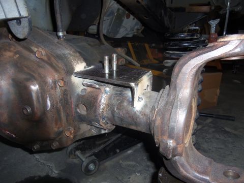 1968 Ford Bronco - This photo shows a custom bracket welded onto a vehicle's rear axle, likely for suspension modification.
