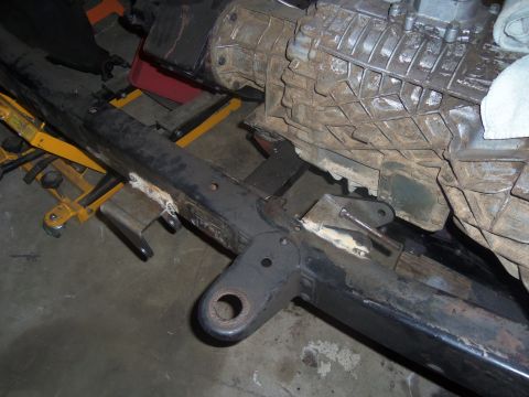 1968 Ford Bronco - Close-up of a vehicle's frame and transmission, indicating custom modifications and parts.