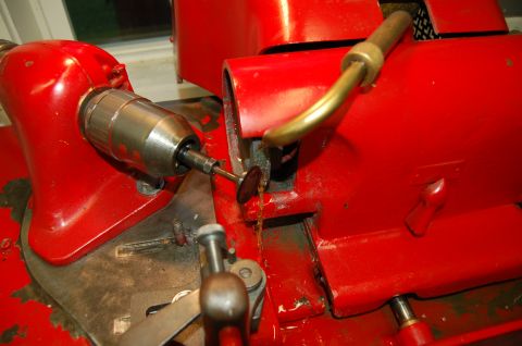 2000 Subaru Forester - A close-up view of a valve grinding machine in operation, with a small cutting wheel attached to a drill.