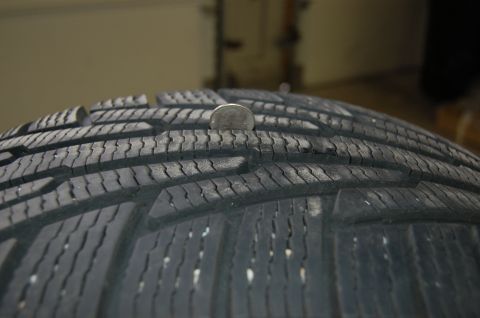 2000 Subaru Forester - Tire tread depth measured with a quarter.
