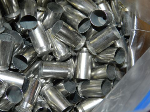 1996 Ford Bronco - A large pile of spent shell casings, some with visible rimfire bases.