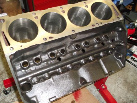 1969 Ford Torino - Close-up of an engine block on a stand, showing the cylinder bores and oil pan area.