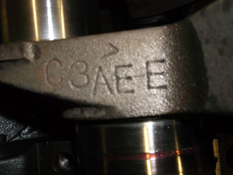 1969 Ford Torino - Metal engine component shows casting marks C3AE and a hint of red fluid.