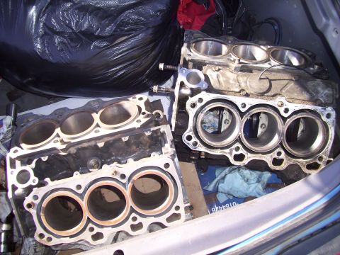 1995 Ford Probe - Two engine blocks are shown in the back of a vehicle, possibly for repair or transport.