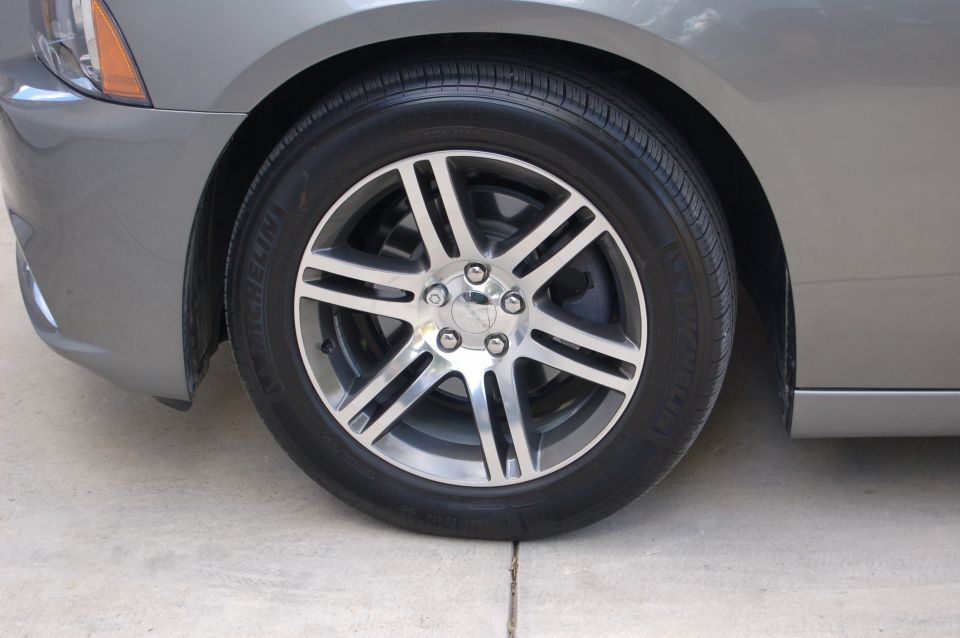 Gray 2012 Dodge Charger front wheel and fender