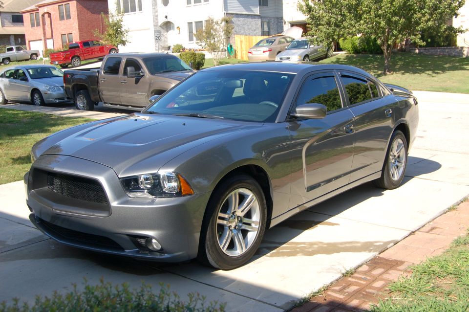Gray 2011-2014 Dodge Charger parked on driveway, front 3/4 view