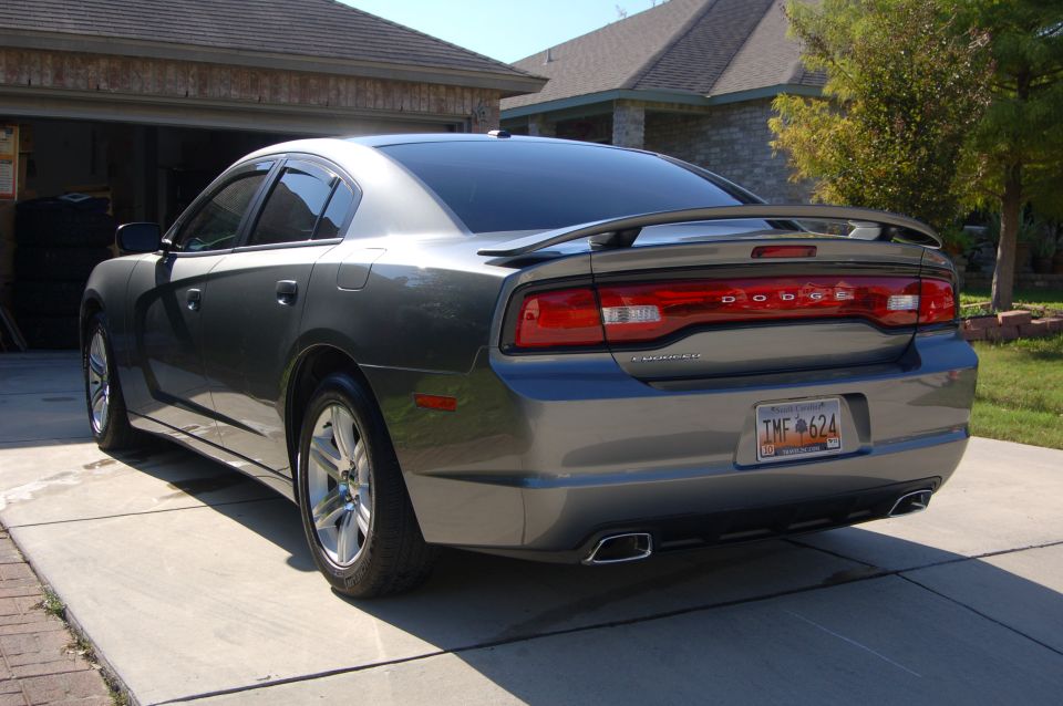 Rear view of a gray Dodge Charger parked on a driveway