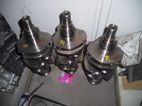 1995 Ford Probe - Three engine crankshafts are shown, likely for automotive use.