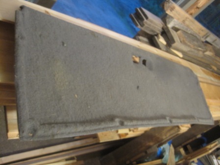 1993 Ford Bronco - Interior door panel, possibly for a Ford Bronco, shown in storage.