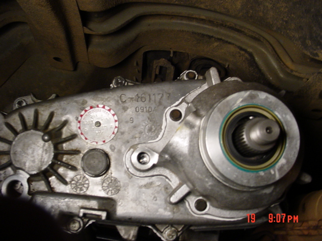 Cast aluminum transfer case housing with output seal and casting number C-461177