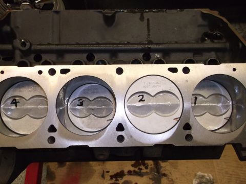 1969 Ford Torino - Close-up view of an engine block revealing pistons labeled 1 through 4, with visible part numbers.