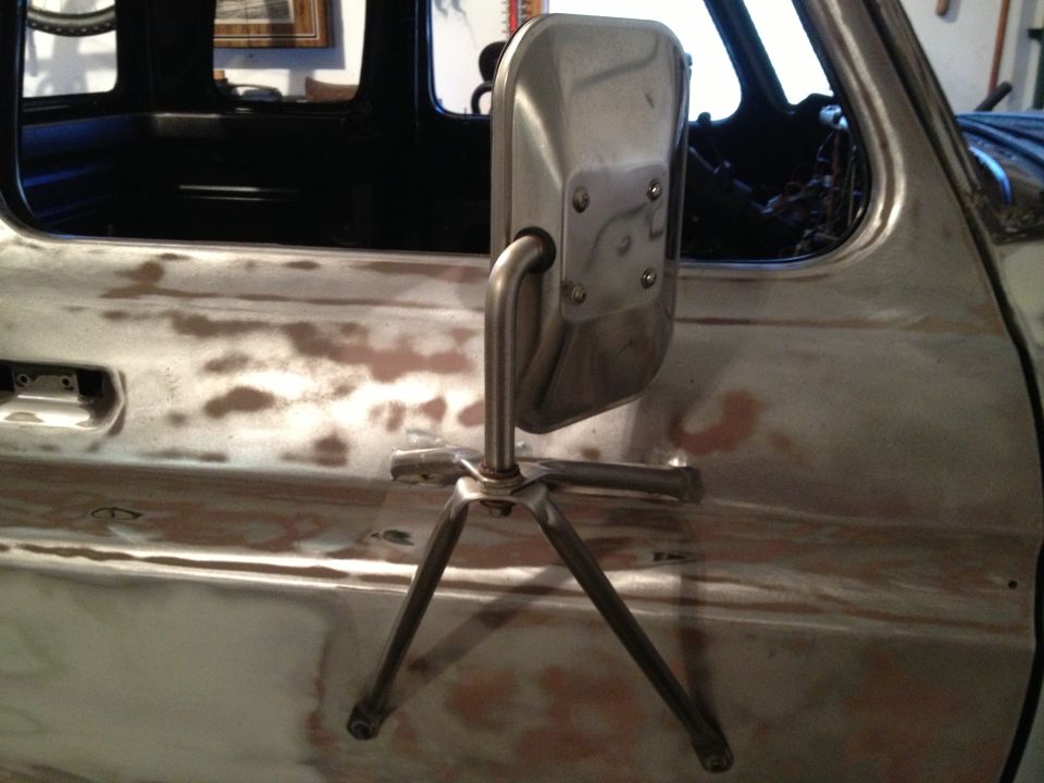 Truck door with side mirror mount, bare metal finish