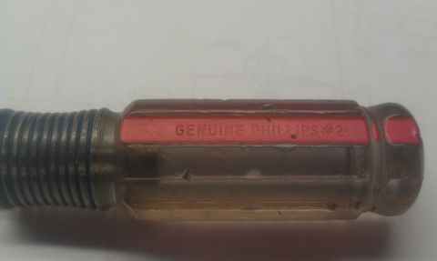 1965 Ford Mustang - Close-up of a screwdriver handle with visible text indicating it is a Genuine Phillips #2.