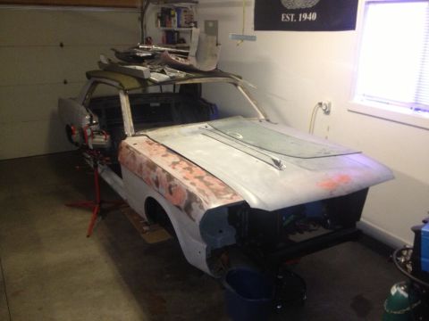 1965 Ford Mustang - 65 Mustang hood/fender on. Checking for missing hardware.