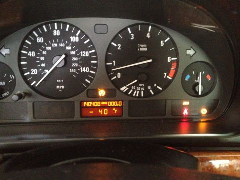 1999 BMW 5 Series - The dashboard displays the speedometer, tachometer, and fuel gauge, with the odometer reading 140,408 miles.