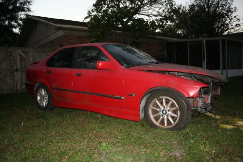 1996 BMW 3 Series - This red BMW 3 Series sedan shows significant damage to its front end.