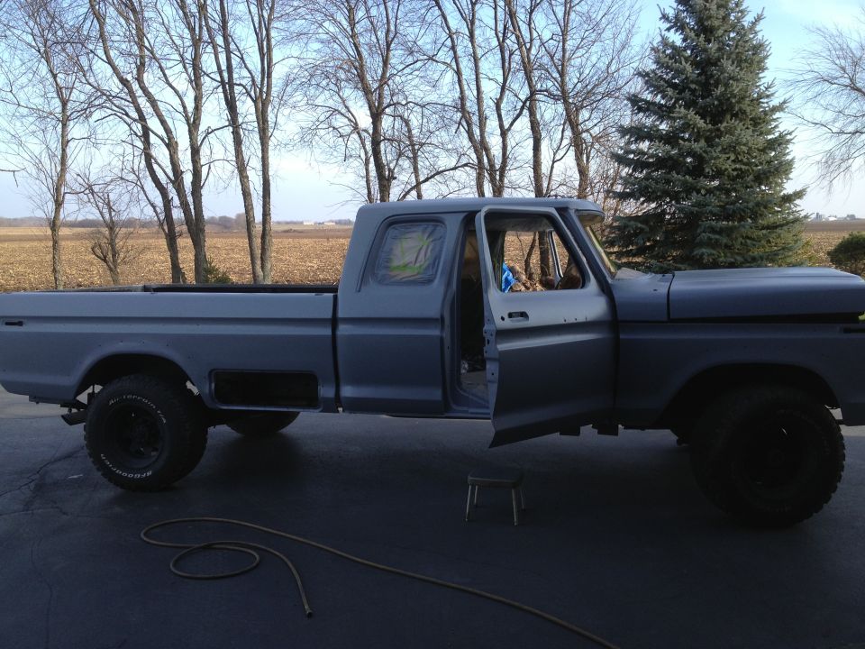 Gray 1979 Ford F-350 pickup truck, side view, doors open