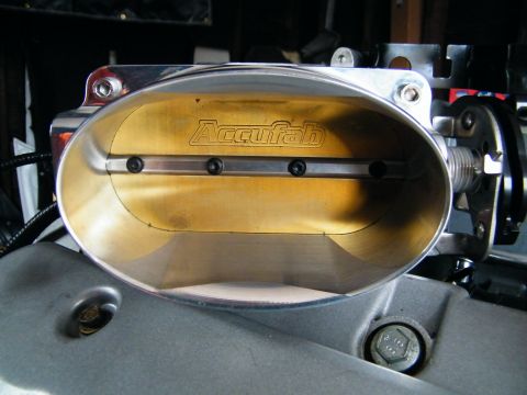 2004 Ford Crown Victoria - Accufab throttle body shown in detail, part of an engine assembly.