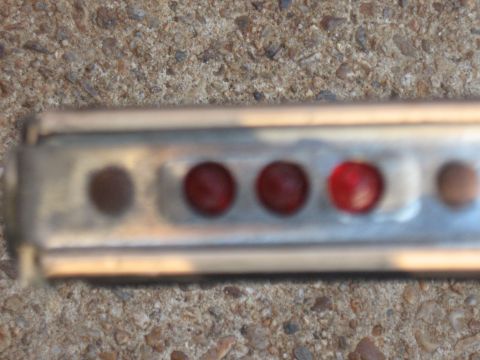 1994 Ford Bronco - A close-up view of a gauge cluster several red indicator lights.