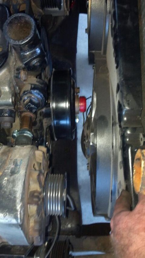 1978 Ford Bronco - Close-up view of engine components, including pulleys and belts, with a red cap visible on one pulley.