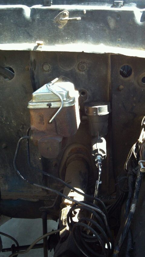 1978 Ford Bronco - Close-up view of the brake master cylinder and booster assembly.