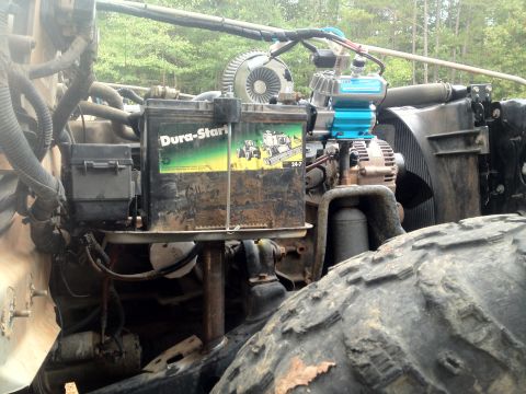 2000 Jeep Wrangler - Close-up view of the engine compartment, showing various components and a large tire.