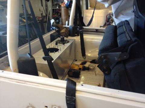 2000 Jeep Wrangler - Interior view of a Jeep with a custom fuel tank installation and tools present.