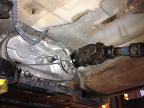 2000 Jeep Wrangler - Close-up view of the vehicle's transfer case and driveshaft assembly.