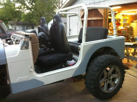 2000 Jeep TJ - This Jeep is undergoing modifications, new seats and an exposed engine bay.