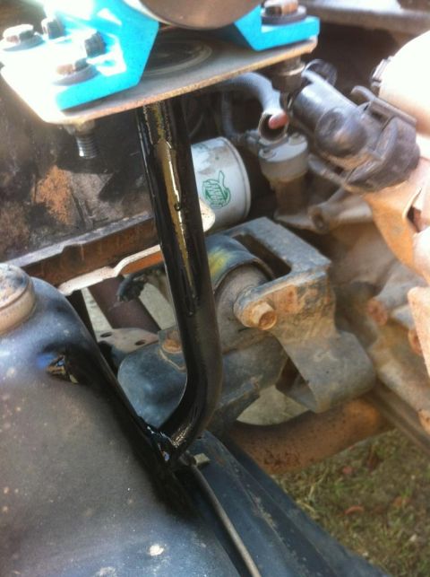 2000 Jeep TJ - Close-up view of an engine component, possibly a transmission mount, with an oil filter visible.