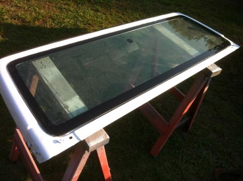 2000 Jeep TJ - A detached Jeep hardtop is shown outdoors, supported by sawhorses.