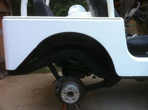 2000 Jeep TJ - Rear suspension and bodywork of a 2000 Jeep TJ, shown with wheel spacers installed.