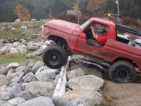 1978 Ford Bronco - Red 1978 Ford Bronco navigates a challenging rock crawling course.