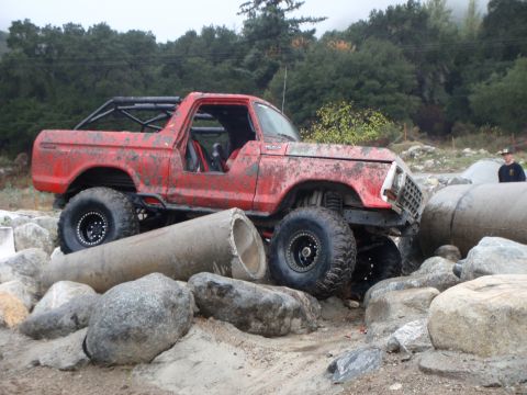 1978 Ford Bronco - This modified 1978 Ford Bronco navigates a challenging rocky terrain with large concrete pipes.
