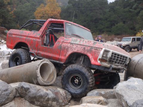 1978 Ford Bronco - This modified 1978 Ford Bronco is navigating a rocky obstacle course with concrete pipes.