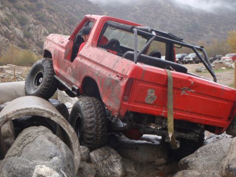 1978 Ford Bronco - This modified 1978 Ford Bronco navigates a challenging off-road course, demonstrating its capabilities.