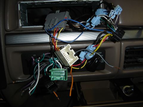1996 Ford Bronco - Wiring for a car stereo is exposed on the dashboard.