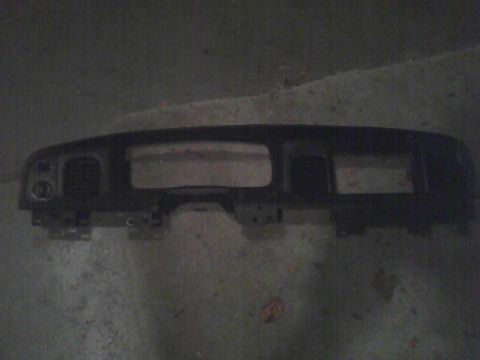 2003 Ford Crown Victoria - This is a dashboard panel, likely from a car's interior, shown removed from the vehicle.
