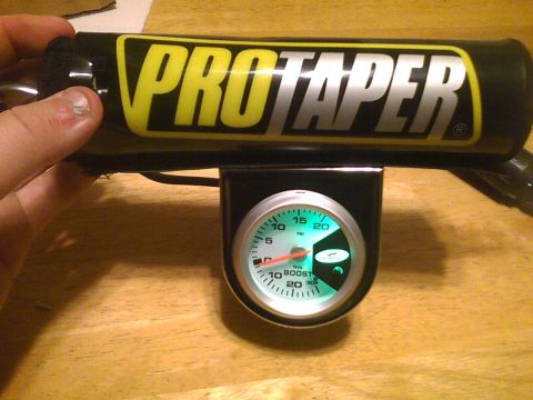2003 Ford Crown Victoria - A ProTaper handlebar is shown with a boost gauge mounted below it.