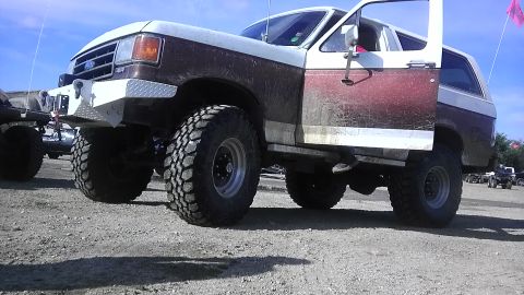 1989 Ford Bronco - This lifted Ford Bronco has a custom bumper and large off-road tires.