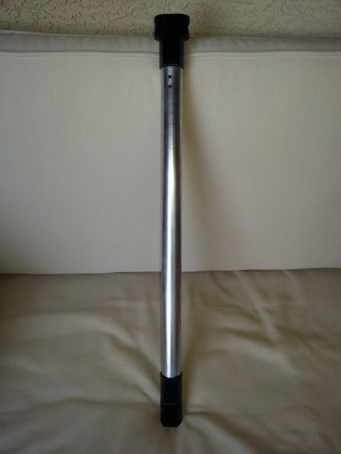 1978 Ford Bronco - A silver metal pole with black caps on either end is shown against a neutral background.