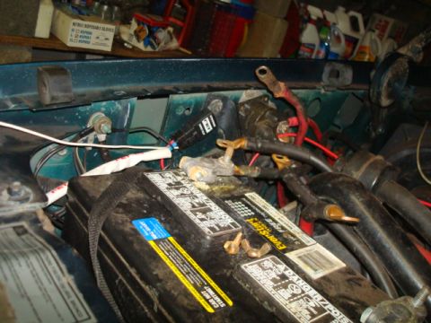 1995 Ford Bronco - The vehicle's battery and associated wiring are shown in detail within the engine compartment.