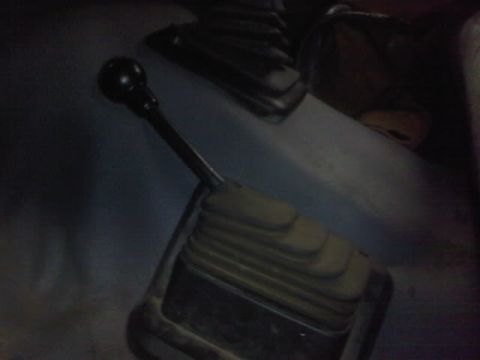 1994 Ford F-150 - Close-up view of a vehicle's gear shifter and surrounding console area.